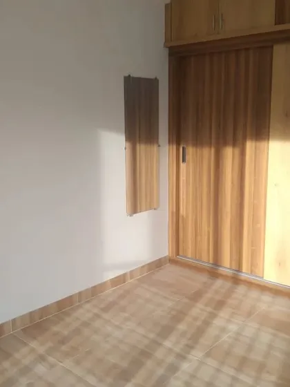 The natural wood grain on this sliding wardrobe door was enhanced with a protective polish, keeping the look classic and warm.