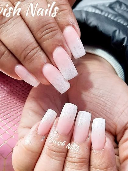 A delicate Baby Boomer ombre with a light dusting of glitter on the tips.