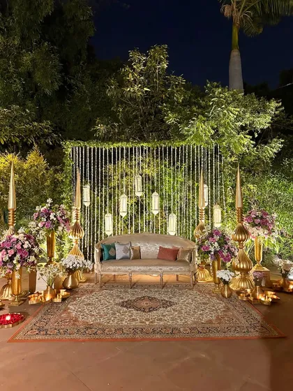 I believe a backdrop should be more than just a photo spot, it should be a piece of art. Here, soft lights, warm brass, and lush florals come together to create a perfect stage for wedding memories.