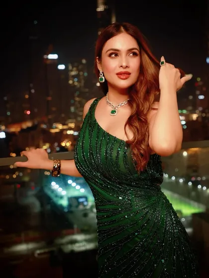 A close-up focusing on the emerald jewellery that I paired with the gown to create a cohesive, monochromatic look.