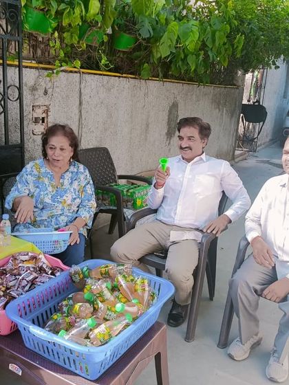 Enjoying a simple moment of joy while helping distribute birthday treats.