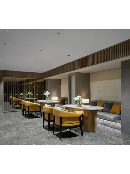 The mezzanine level of the Blue Sea Banquet, designed as a sophisticated lounge area. The space features elegant seating, warm lighting, and decorative partitions, making it a perfect breakout area for events.
