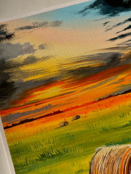 A close-up view of the dramatic sky in my haystack painting. I love blending the oranges, yellows, and dark greys to create a powerful sunset.