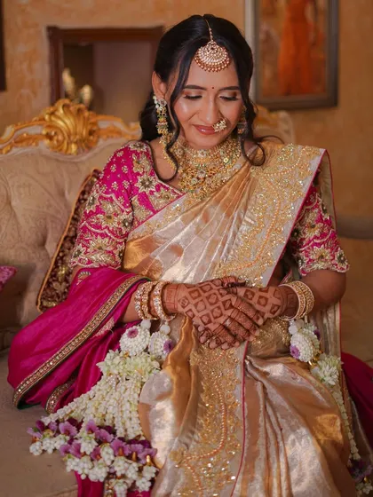 A serene portrait of the mother-to-be, with her hands gently on her belly, showcasing our floral hathphool.