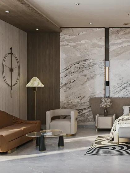 This master bedroom is a showcase of layered luxury, featuring a stunning full-height marble wall behind the bed. We paired this bold statement with warm wood paneling and sculptural furniture to create a space that is both rich and restrained.
