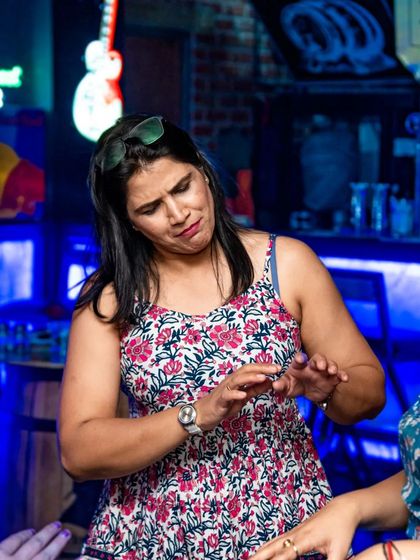 Two friends enjoying a chat and the music.