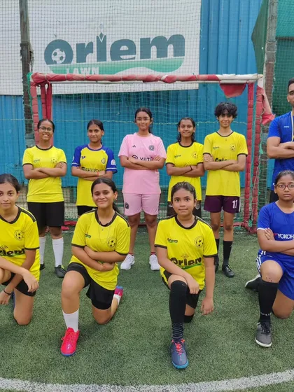 Our girls' batch posing for a team photo. We are proud to be growing our female football program and welcome new players to join.