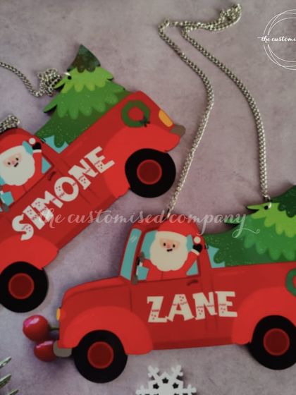 Add a personal touch to your Christmas tree with these adorable truck-themed ornaments. Each one is customized with a name, making it a special keepsake for kids to hang year after year.