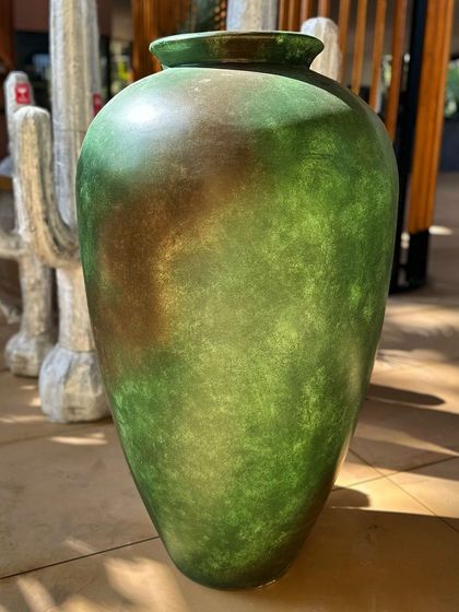 Introducing the 'Azure' planter, a tall vase with a smooth, blended green and brown finish.