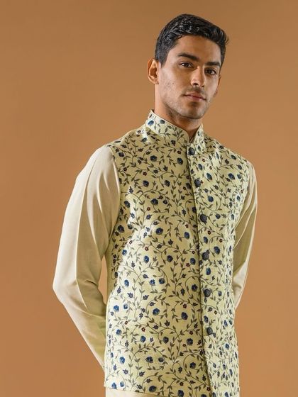 A closer view of the pastel green floral Jawahar jacket, highlighting the clean print and sharp tailoring. It is a perfect piece for summer celebrations.