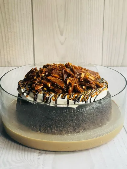 This is my Mocha Caramel Almond Praline Tres Leches. The combination of coffee, gooey caramel, and crunchy almond praline makes every bite a magical experience.