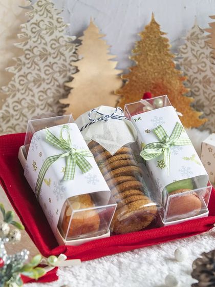 A Christmas tray featuring an assortment of our goodies, including cookies and mini bar cakes, all individually wrapped for easy sharing.