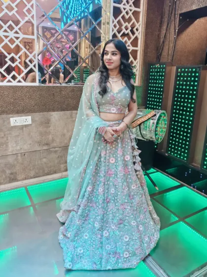 This pastel green lehenga with delicate pink and white floral embroidery is a fresh and beautiful choice for a day function.