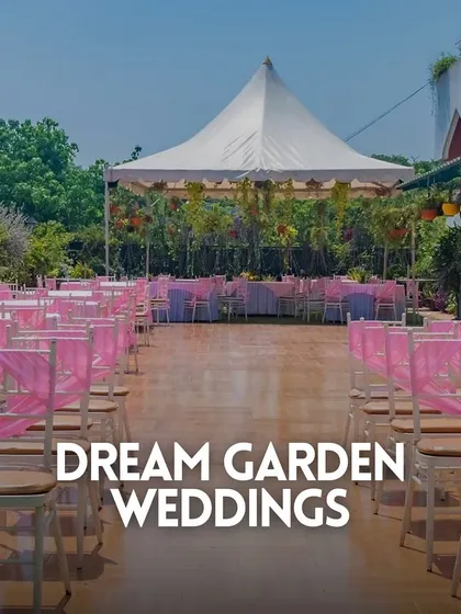 Dream garden weddings come to life in our Terrace Garden, with a wooden aisle and chairs adorned with pink sashes for a romantic touch.