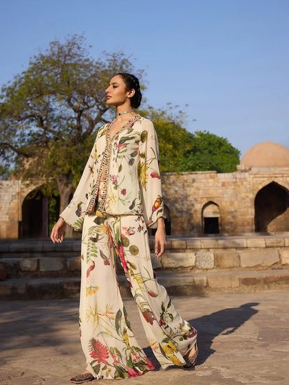 A full view of the floral print co-ord set, showcasing its relaxed, wide-leg pants and flowing jacket, perfect for a resort-chic look.
