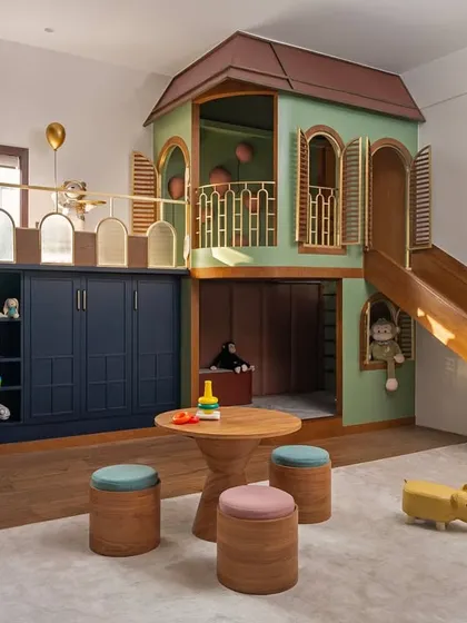 I designed this children's play area as a colorful haven, complete with a custom-built indoor playhouse and slide. The space brings together a vibrant yet soothing pastel palette, creating an imaginative environment for play and creativity.