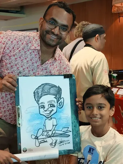 A proud father and son with the son's caricature. It's a wonderful keepsake for families to remember these special occasions.