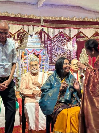 A candid smile during the felicitation by Sree Ramaseva Mandali. The warmth and affection from the organizers and the audience mean the world to me.