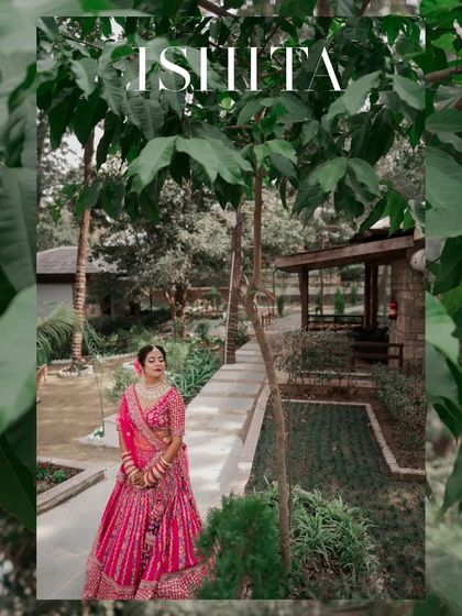 A portrait of the bride framed by green leaves, her serene expression and beautiful attire making for a stunning shot.