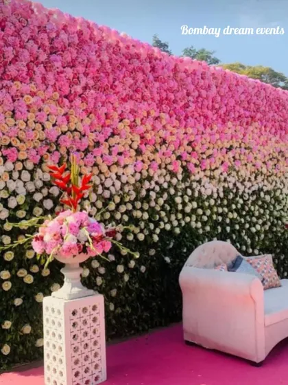 A beautiful ombre flower wall made of fresh pink, white, and green florals. This makes a luxurious backdrop for a baby shower, engagement, or reception.