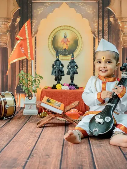 A happy little musician with a tanpura. I use various traditional instruments as props to create diverse and engaging shots within the 'Chota Varkari' theme.