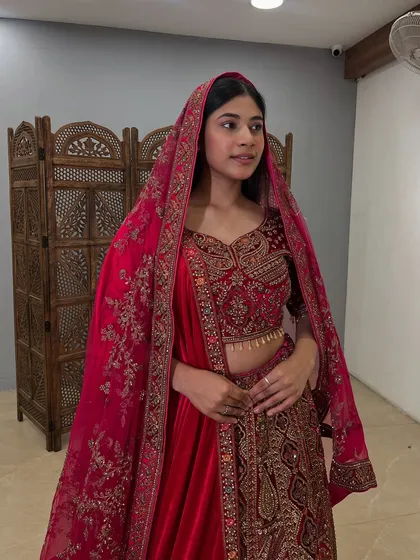 A close-up of the embroidered blouse and the soft velvet fabric that makes this bridal lehenga so special.