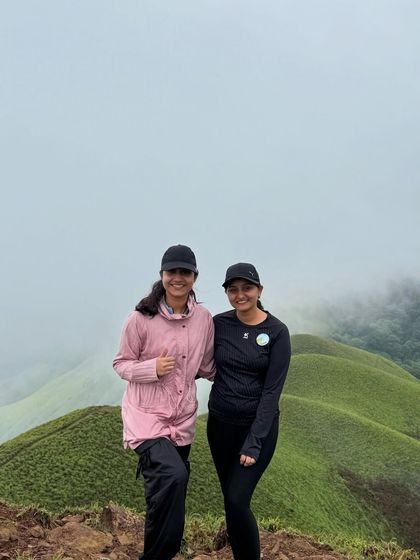Two friends posing together on the trail, enjoying their shared adventure at Netravathi.