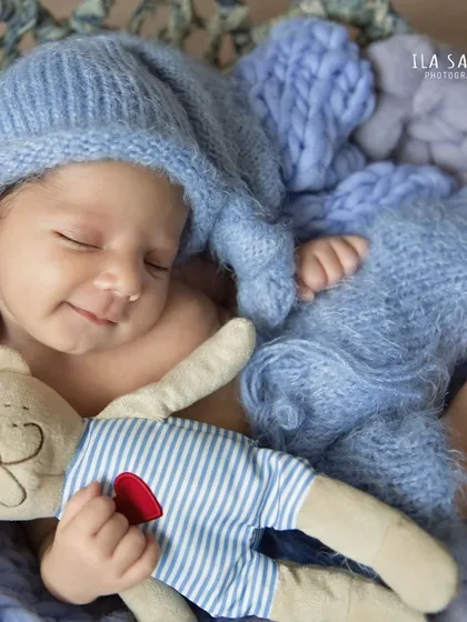 It's rare, but when you catch a newborn's smile, it's pure magic. My newborn sessions are always patient and gentle, creating a warm and comfortable space for these tiny, perfect moments to happen.