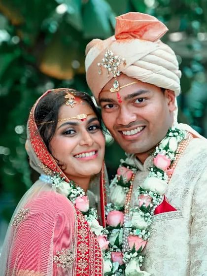 A happy portrait of a newly married couple, their smiles showing the joy of the moment.