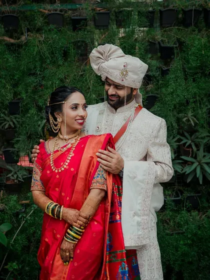 I love creating timeless couple portraits against natural backdrops. Here, the groom looks at his bride with so much affection, a candid moment that perfectly captures the beginning of their journey.