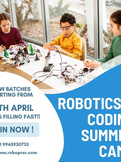 A group of young students collaborating on building and programming robots. Our summer camp provides a fun, hands-on environment for kids to learn valuable coding and engineering skills.