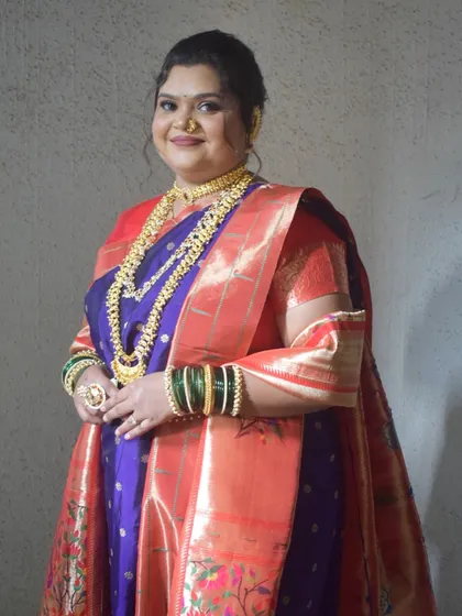 A full-length shot showcasing the rich colors and weaving of the traditional Paithani saree.