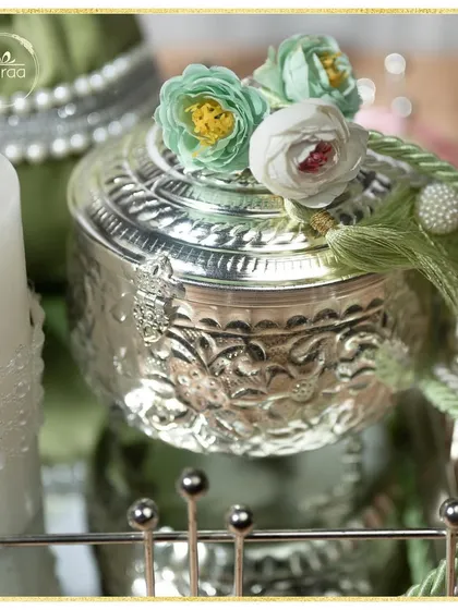 A close-up of the details. I love using embossed silver jars and topping them with delicate handmade flowers and tassels to add a touch of bespoke charm to my hampers.