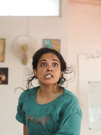 An actor makes a face during a "Gretel" rehearsal.