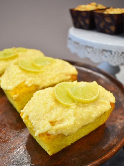 A burst of sunshine in every bite. My zesty and moist Lemon Coconut mini loaf cake is topped with a tangy glaze and fresh lime slices.