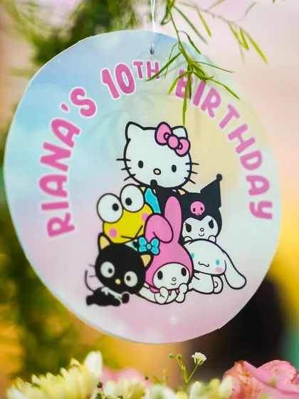 A custom "Riana's 10th Birthday" tag featuring Hello Kitty and her friends.