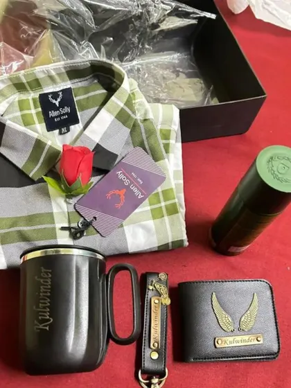 A customer-shared photo of their gift hamper, which includes a personalized wallet, keychain, and mug, along with a checkered shirt and deodorant.