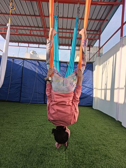 Goats loves me, and kids loves aerial yoga. This young student is in a supported inversion, a pose that is both calming and fun.