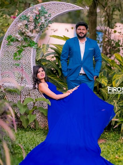 A stylish portrait with a crescent moon prop in the garden, perfect for a unique and dreamy shoot.