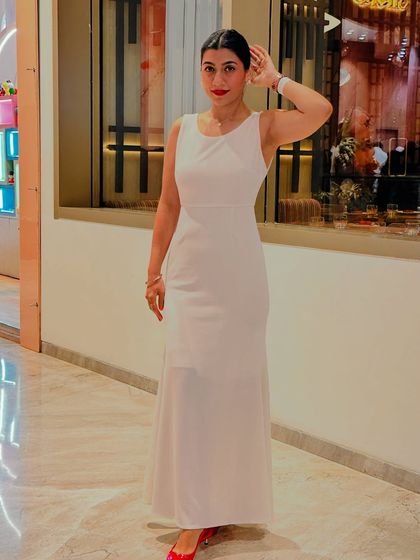 Another shot of my white dress look. The sleek bun, bold red lip, and minimal pearls completed the transformation from a simple dress to a dream look.