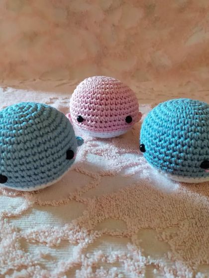 Another angle of the adorable whale toys, showcasing their simple and sweet design.