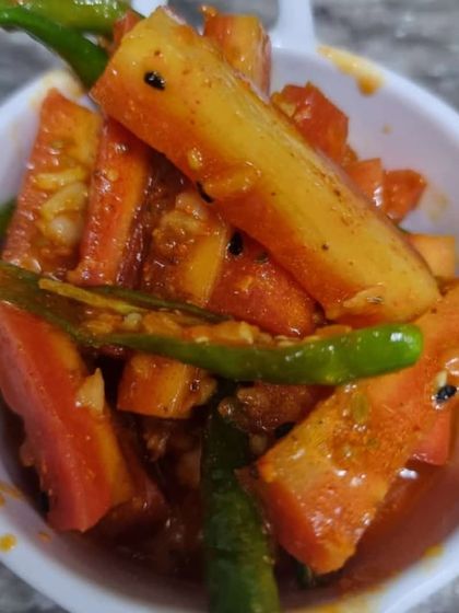 A close look at my carrot and chili pickle. The sweetness of the carrots pairs wonderfully with the mild spice from the green chilies. It's crunchy, tangy, and absolutely delicious.