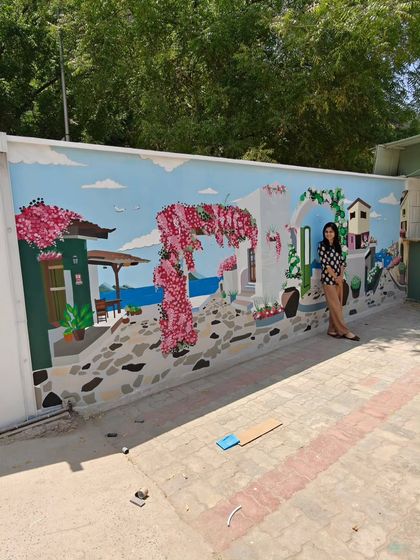 The complete view of the mural from an angle, demonstrating its impressive scale and impact on the space.