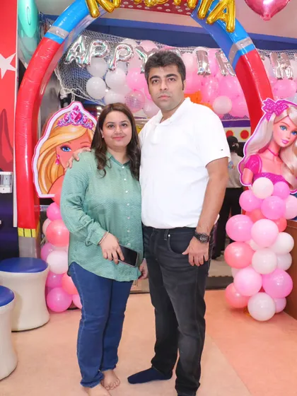Happy parents enjoying their child's Barbie-themed birthday party. I strive to create an environment where everyone feels welcome and has a great time.