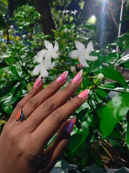 Another look at this sharp pink chrome design. The high-shine finish and precise line work make this a real statement manicure, even with its minimalist color palette.