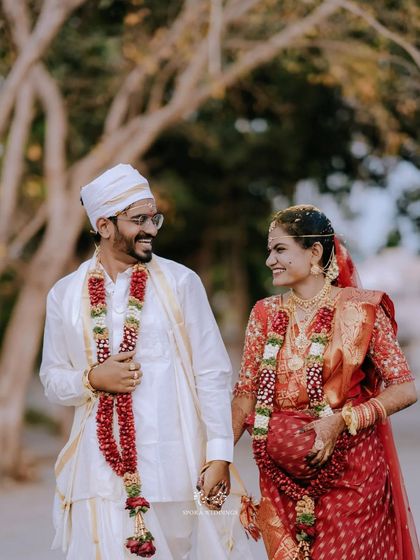 The couple walking hand-in-hand, their faces filled with joy and laughter after their wedding ceremony.