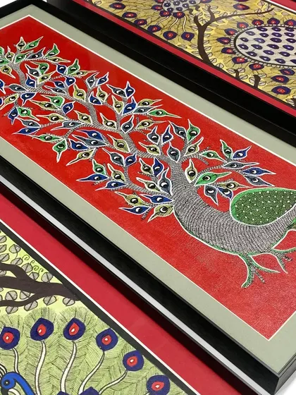 We love these beautiful peacock artworks, which are perfectly complemented by a combination of gray and red mats within a simple black metal frame. The mat colors pick up the tones in the art, creating a harmonious look.