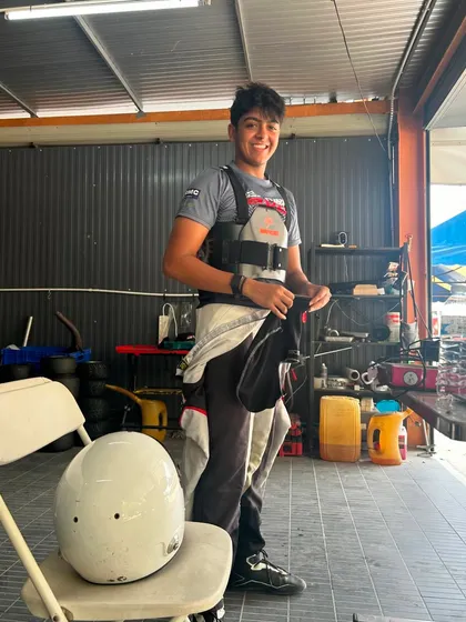 A duplicate shot of a driver relaxing in the pit garage.