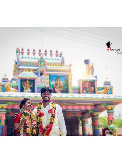 A happy, smiling portrait of the couple outside the temple. The bright daylight and their joyful expressions make this a wonderful memory of the moment right after they were married.