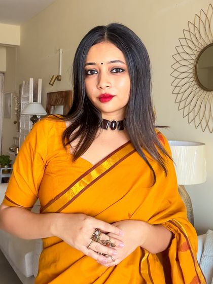 A portrait shot showcasing the flattering neckline of the blouse that came with the saree. Getting the blouse right is key to a polished festive look.